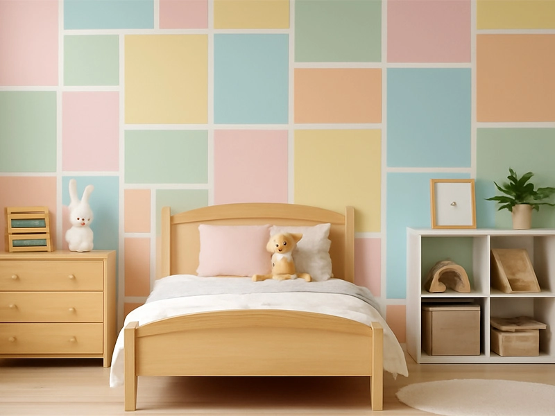 Desain dinding dengan kotak dan persegi panjang berwarna pastel bertumpuk di kamar anak